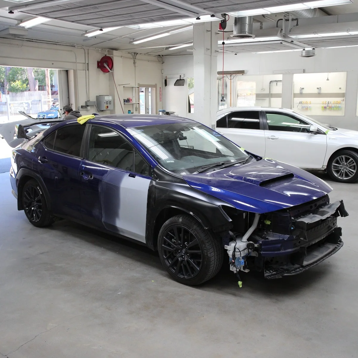 Blue Subaru during repair
