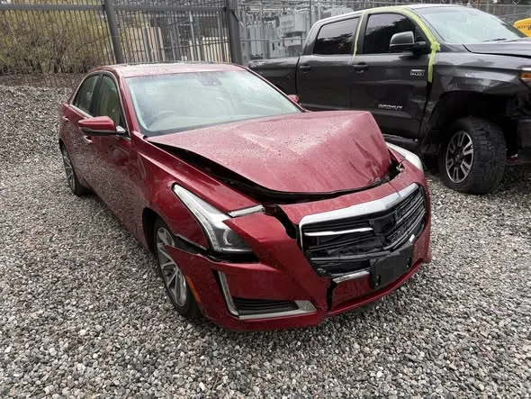 Red Cadillac before repair