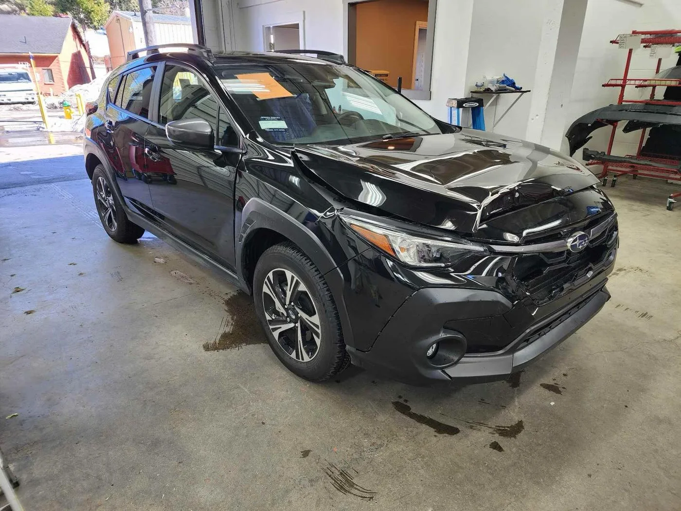 Black Subaru before repair